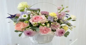 flowers in basket arrangement designed by Ambrosia Floral Studio