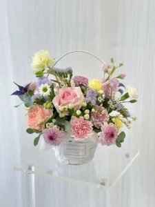 Fresh flowers in basket arrangement designed by Ambrosia Floral Studio